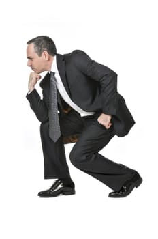 Thinking businessman in a suit isolated on white background