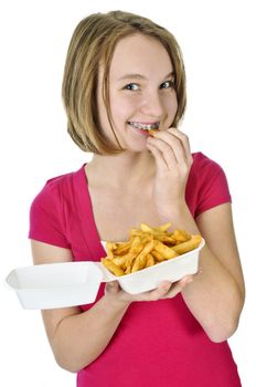 Teenage eating french fries isolated on white background