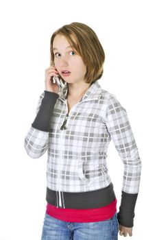 Teenage girl talking on a cell phone acting surprised isolated on white background