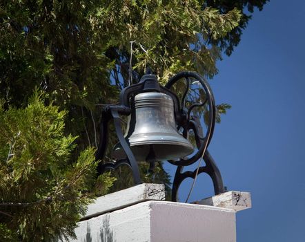 Ornate siliver colored bell outside the Ysabel Chapel near San Diego