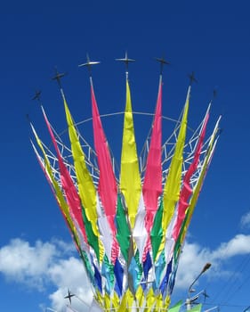 colorful flags on blue sky witn clouds  background