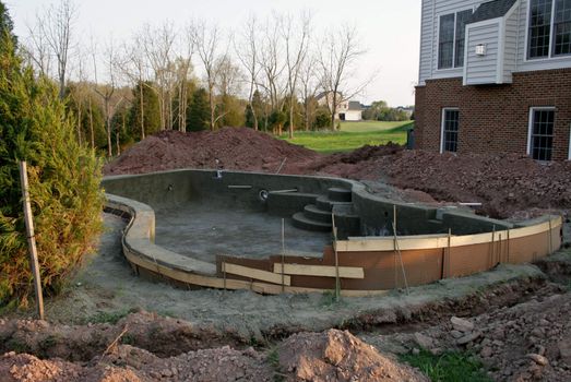 Creating a concrete swimming pool in residential back yard