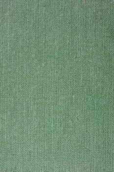 green textile background from a vintage 1960s book cover