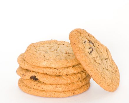 A stack of oatmeal raisin cookies on a white background.