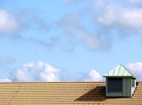 Roof and the blue sky with some clouds