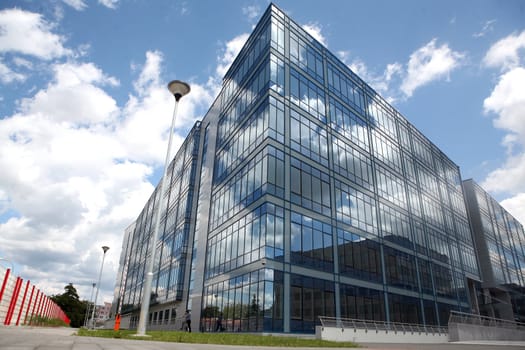 New modern futuristic building and blue skyes in cloudy day