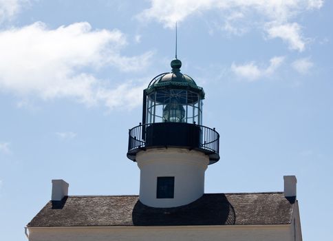 Old lighthouse on Point Loma near San Diego with a bright blue sky framing the shot