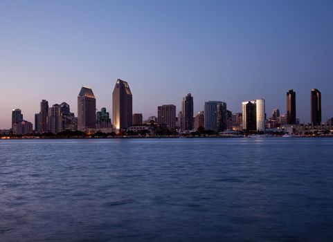 Sun setting lights up the buildings on San Diego seafront