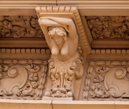 Detail of the carvings on the Casa de Balboa building in Balboa Park in San Diego with naked female figure