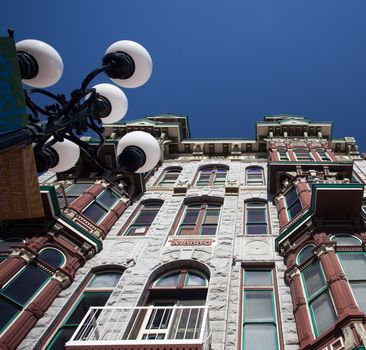 Gaslamp district of San Diego with the old Louis Bank of Commerce building set by ornate gas lamps