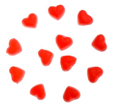 many heart shaped fruit jellies, located on circle, isolated on white