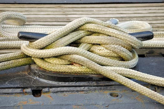 A ship tied down at a dock.