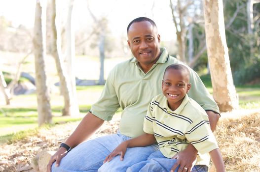 Man and Child Having fun in the park.