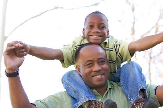 Man and Child Having fun in the park.