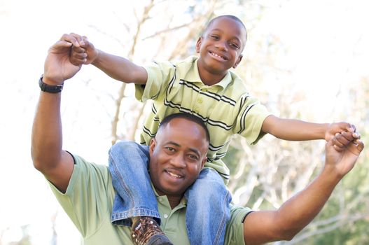 Man and Child Having fun in the park.