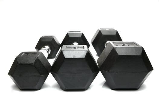 Weight lifting dumbbells isolated against a white background