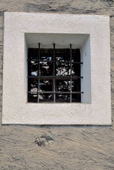 window on a wall of a church in mountain