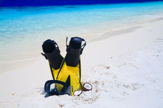 snorekl equipment on white sand beach at Maldives