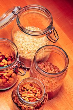 looking down on open glass jars on counter top