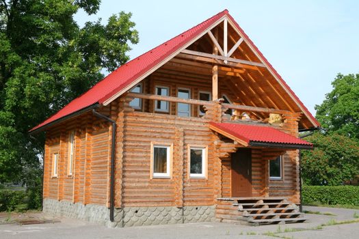 new serial wooden house with red roof from tile, real estate