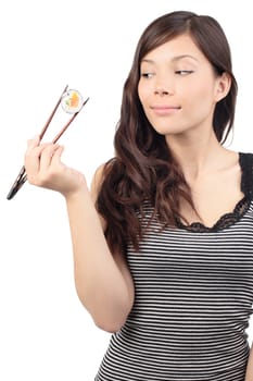 Sushi woman holding sushi with chopsticks looking to the side. Isolated on white background, Asian / Caucasian model.