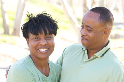 Happy Affectionate Couple posing in the park.