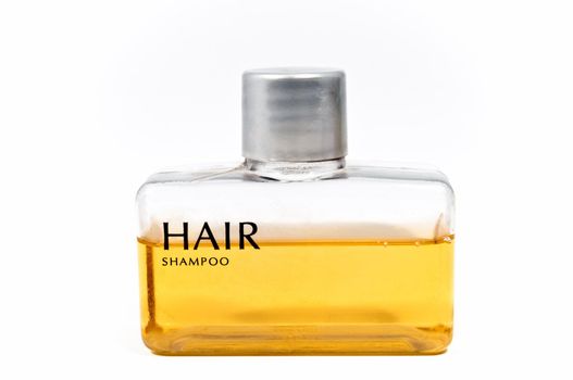 Small shampoo bottle isolated on white background