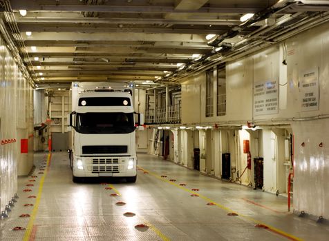 The truck on a cargo deck of the ferry