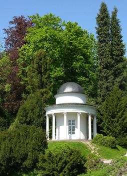 Ancient pavilion in a magnificent park scenery