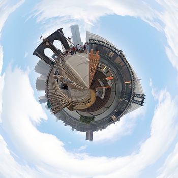 A three dimensional mini planet style panoramic image of the New York City skyline including the Brooklyn and Manhattan Bridges.