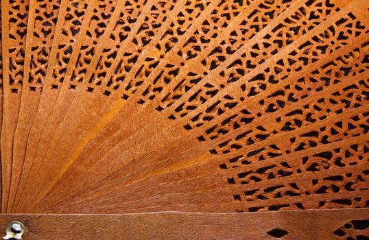 Beautiful pattern of wooden fan closeup