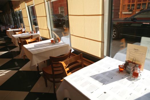 Interior of the Fish Restaurant in Solar Morning, Tables