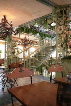 open-work metallic stairway in interior of the luxurious building