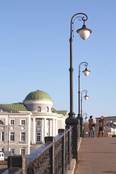 Moscow, Russia, Torch on Luzhkov Bridge and Old House on Kadashevskaya Quay, Tourists