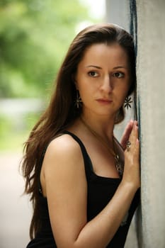 portrait of a beautiful young bride against wall