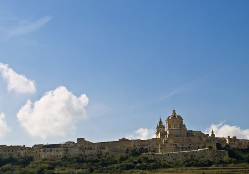 The dome of the medieval cathedral overlooking the bastions of the old city of Malta, Mdina.