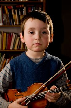 boy holding violon