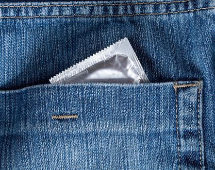 blue jeans hip-pocket with condom in it, macro shot