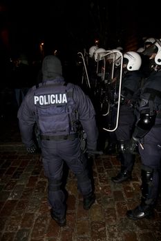 Agresive crowd and police near Latvian Parliament. Riga, Latvia, January 13, 2009