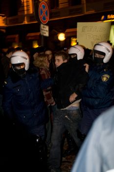 Agresive crowd and police near Latvian Parliament. Riga, Latvia, January 13, 2009