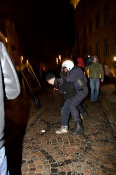 Agresive crowd and police near Latvian Parliament. Riga, Latvia, January 13, 2009