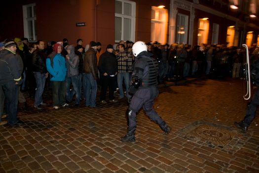 Agresive crowd and police near Latvian Parliament. Riga, Latvia, January 13, 2009