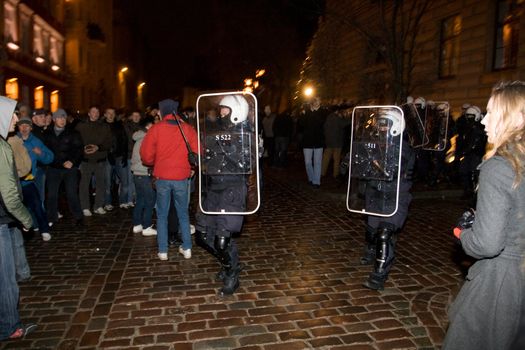 Agresive crowd and police near Latvian Parliament. Riga, Latvia, January 13, 2009