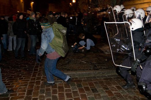 Agresive crowd and police near Latvian Parliament. Riga, Latvia, January 13, 2009