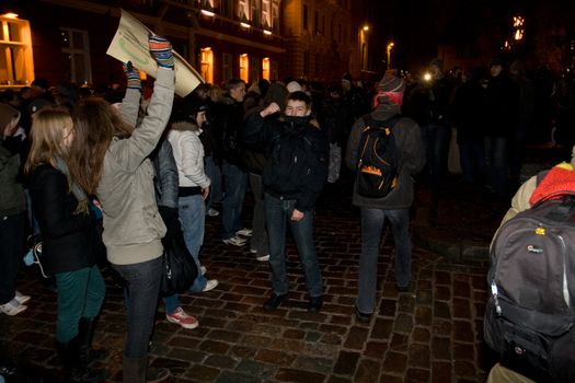 Agresive crowd and police near Latvian Parliament. Riga, Latvia, January 13, 2009