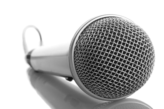 close-up silver microphone with reflection, isolated on white