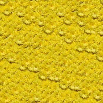 Seamless pattern made of yellow chrysanthemum flowers. It's composable like tiles without visible connecting line between parts