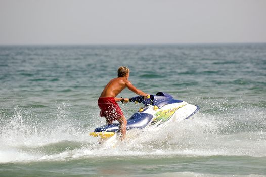 Young man and his jet-ski