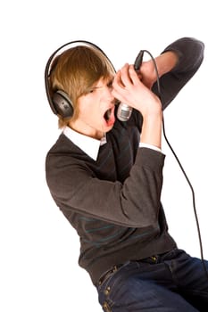 Young man singing wearing headphones isolated on white