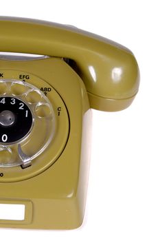 Green old telephone from the 80'ties. On clean white background.